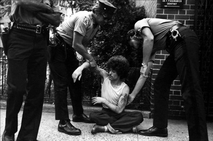 The police are trying to help an addict who has overdosed, 1978.