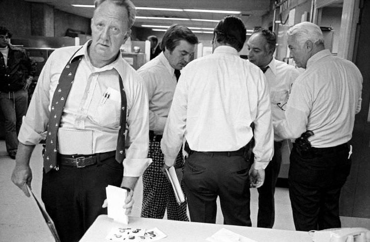 Employees work around the clock over the murder of two policemen, 1972.