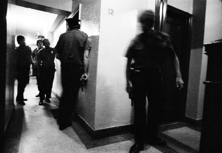 Officers find a family at the dinner table instead of armed men, 1978.