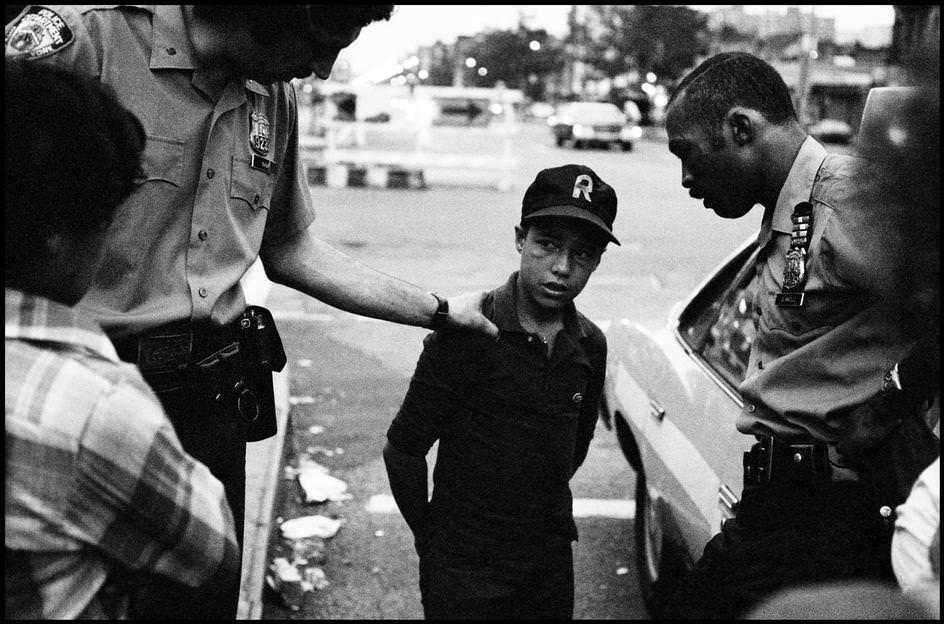 Police separate two fighting teens, 1978.