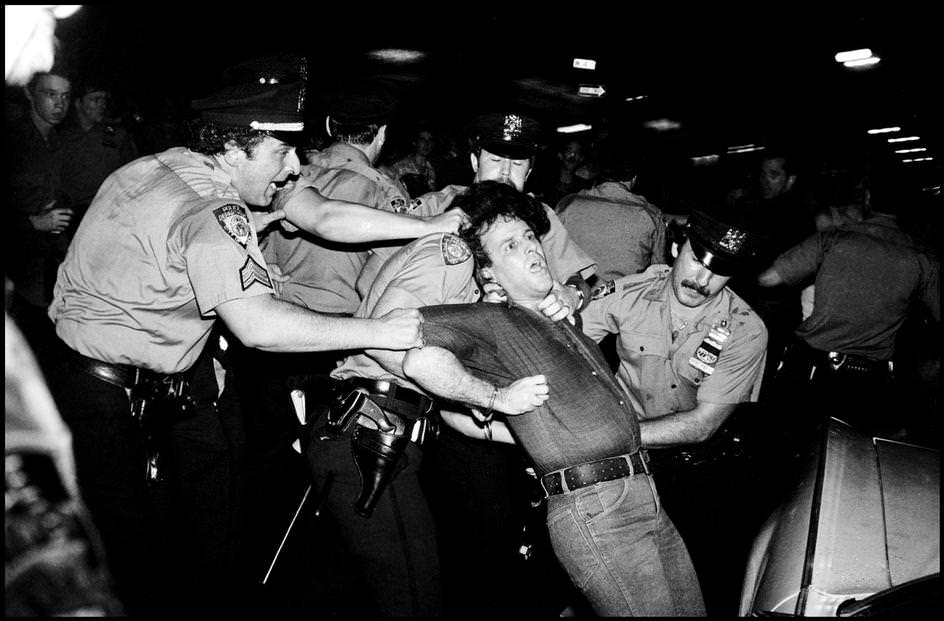 A protester refused to leave the roadway and was taken away by force, 1979.