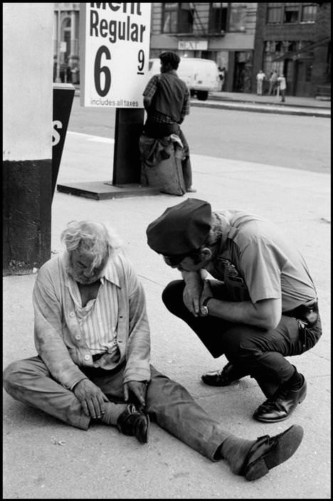 A police officer checks if the man was bad or just drunk, 1978.