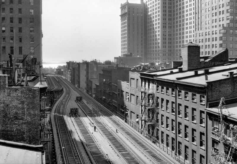 Looking south along west side of Greenwich Street toward Battery over elevated structure, New York, 1940.