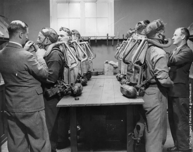 A mine rescue brigade with breathing apparatus, 1934.