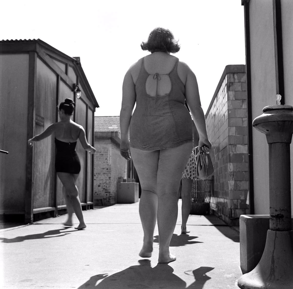 Bulging at beach in 1949, 197-pound Dorothy [Bradley] self-consciously leaves locker room for swim. She covered up embarrassment by being jolly and gregarious.