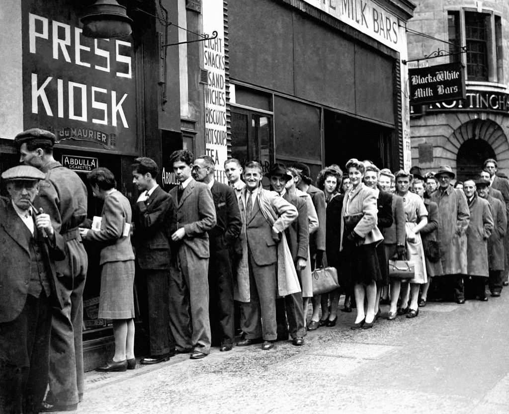 Queues of people wait in Fleet Street during a cigarette shortage.