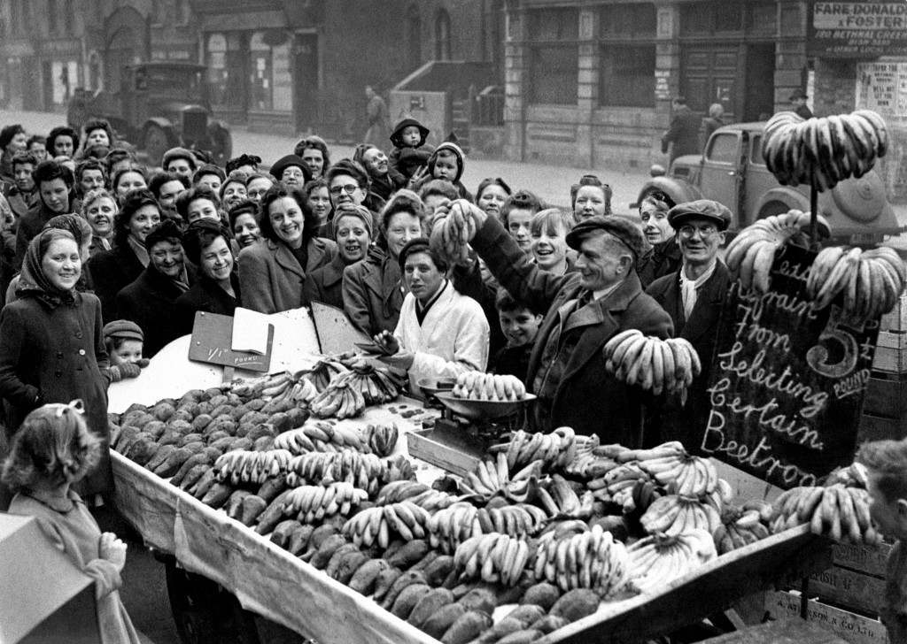 Smiling women queueing for bananas in Bethnal Green, East London, 1946.