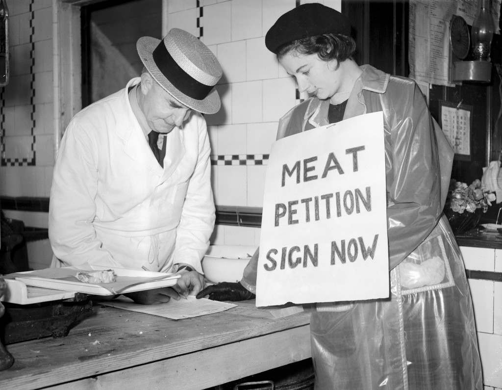 Butcher Charles Wesson signs a petition urging the return of the nation’s meat buying to private traders, 1951.