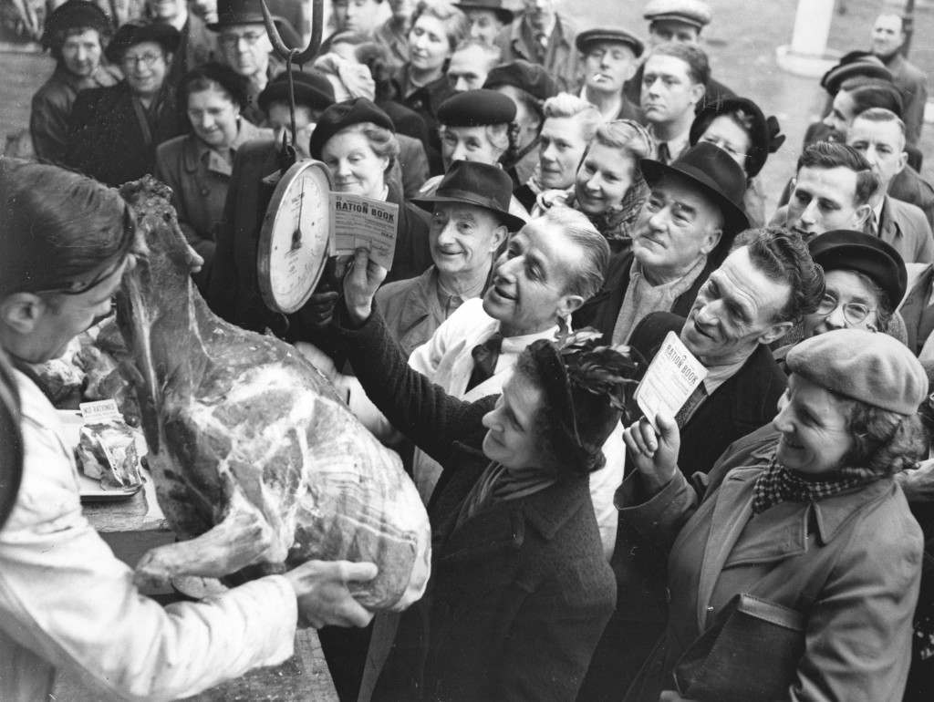 The only thing wrong with this picture is the ration book held by a woman, featuring unrationed reindeer meat, 1951.