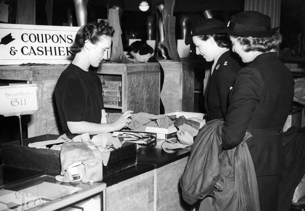 Two Canadian nurses buy stockings in a London store, 1941.