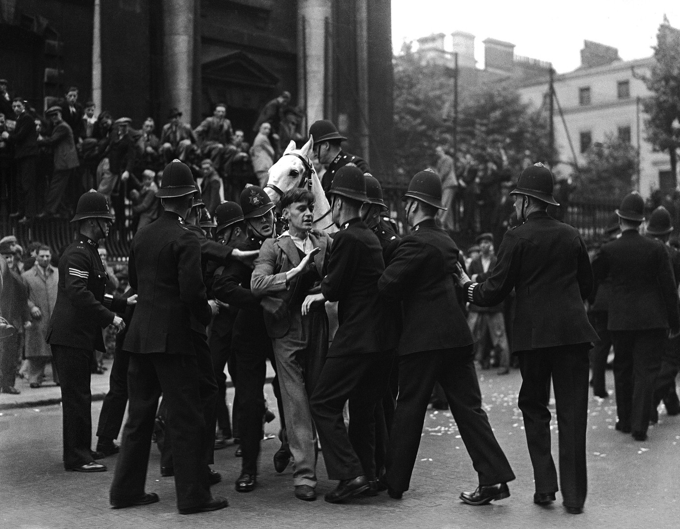 A young demonstrator clashing with police during Sir Oswald Mosley's fascist march in Trafalgar Square, 1937.