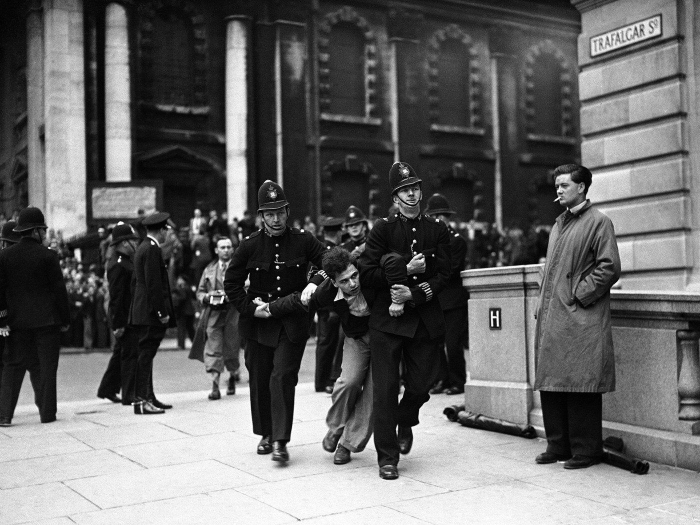 A demonstrator clashing with police during Sir Oswald Mosley's fascist march in Trafalgar Square, 1937.