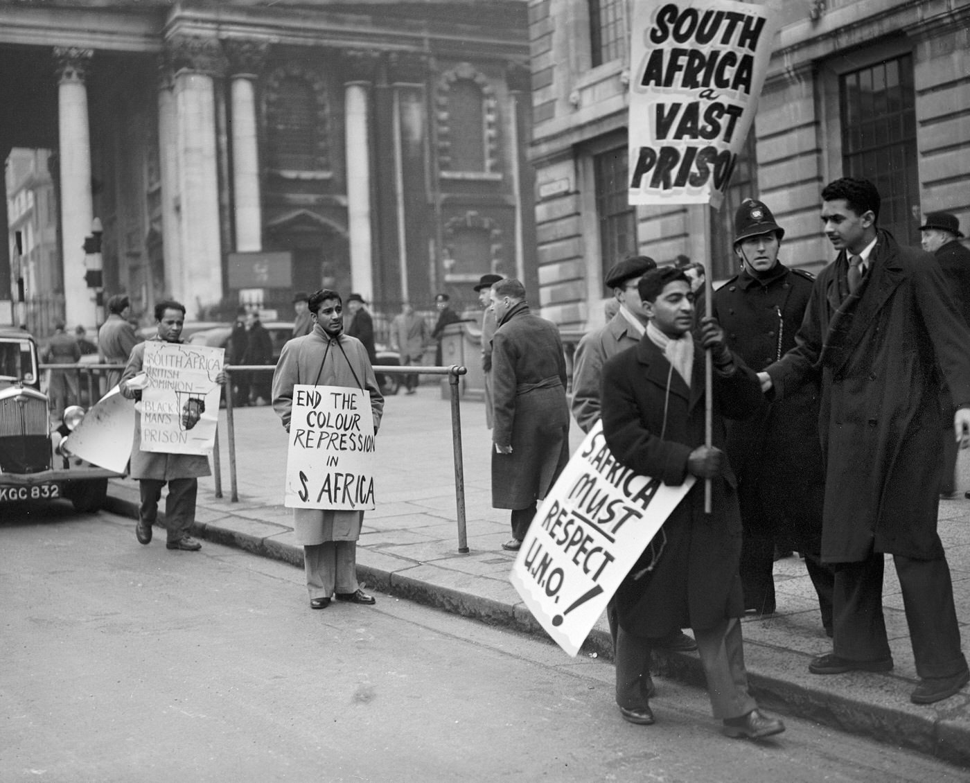 Police advising South African students demonstrating in Trafalgar Square, 1951.