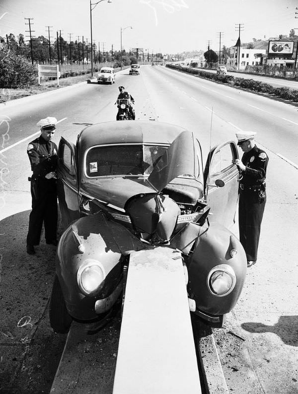Car crashes into concrete slab on Ramona Freeway, Los Angeles, January 28, 1952