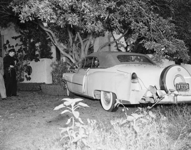 Cadillac after coming to stop at tree, Laurel Canyon and Sunset boulevards, Los Angeles, April 23, 1954