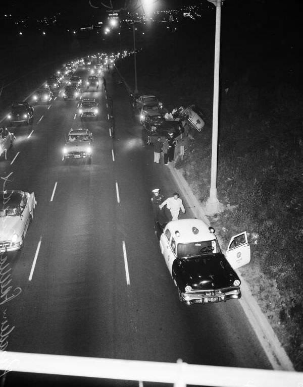 Four cars involved Pasadena Freeway accident at Bishops Road bridge, Los Angeles, July 22, 1955