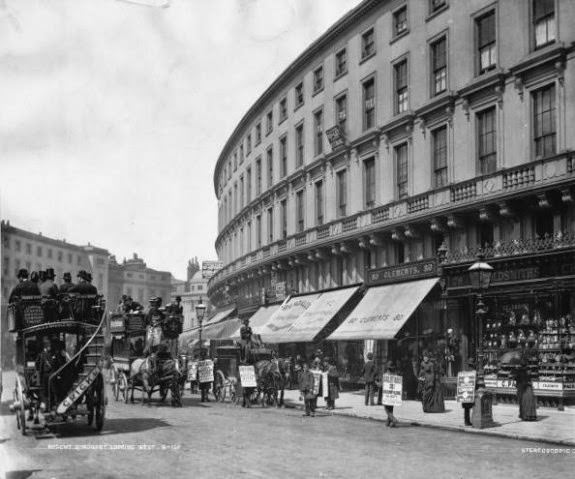 Horse-drawn buses passing sandwich board men on Regent Quadrant, London, 1890.