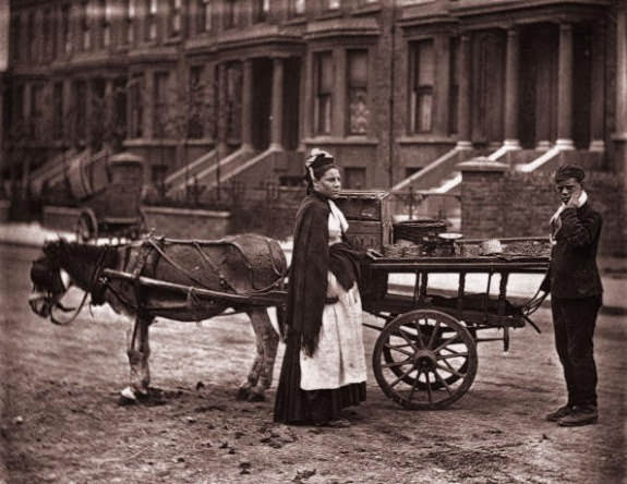 A Victorian fruit seller selling strawberries in a London street, 1873.