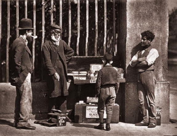 A street trader and shoeshine in Victorian London, 1877.