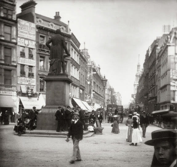 Pedestrians on London's Cheapside, near the statue of Robert Peel, 1890.