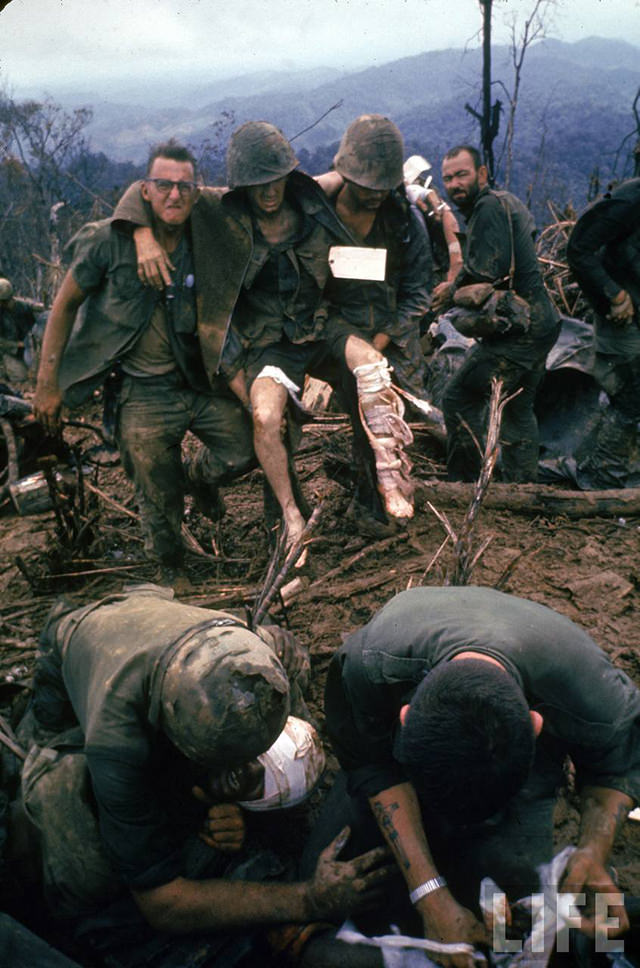 Wounded American Marines being treated and prepared for evacuation during the Vietnam War.