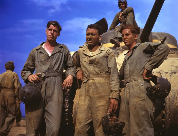 A tank crew in front of an M-4 tank at Fort Knox, Kentucky, 1942.