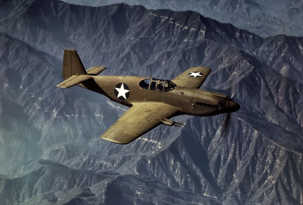 A P-51 Mustang fighter in flight over Inglewood, California, 1942.