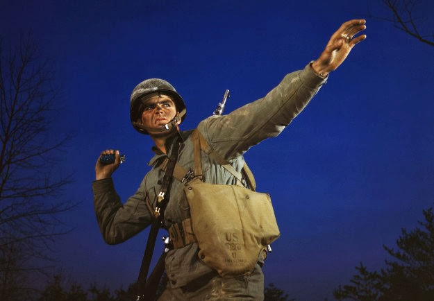 An infantryman in training holds a pineapple at Fort Belvoir, Virginia, 1942.
