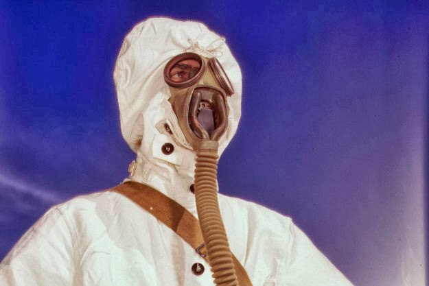 A sailor at the Naval Air Base wears protective clothing and a gas mask in Corpus Christi, Texas, 1942.