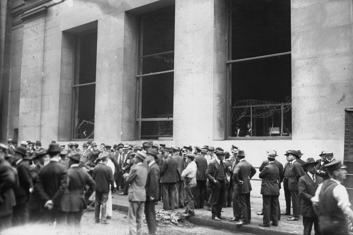 Men standing after the Wall Street bombing, New York City, 1920.