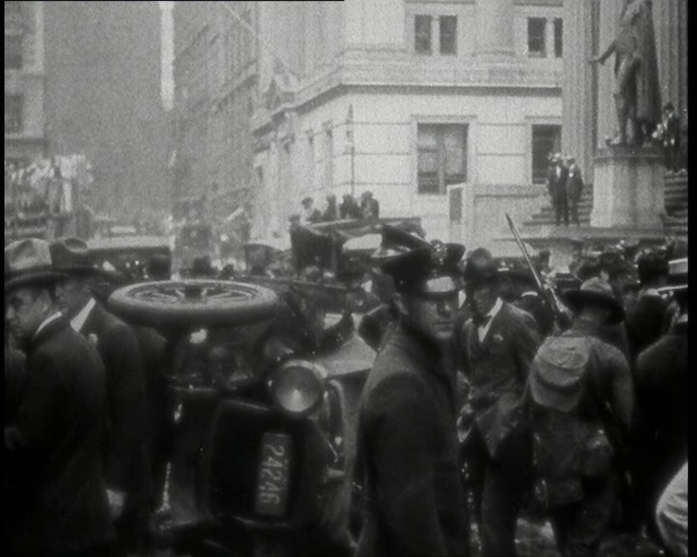 Police surveying overturned vehicles after the Wall Street bombing, New York City, 1920.