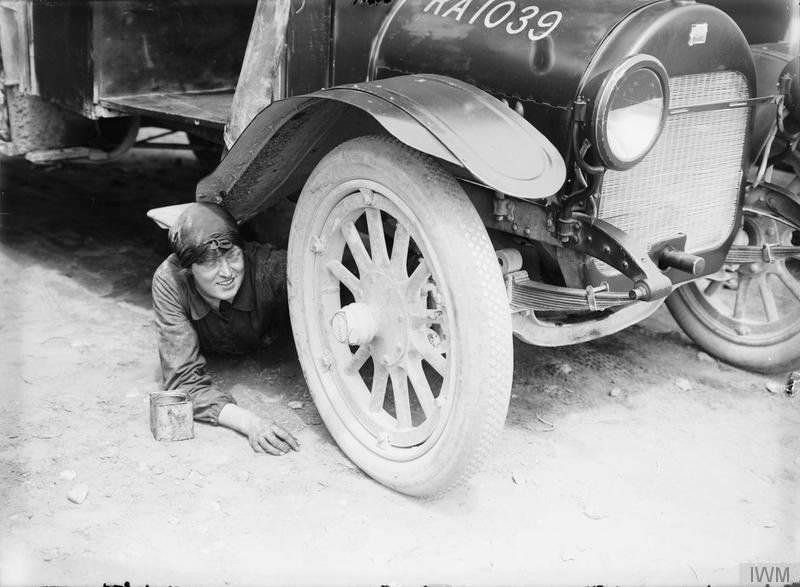 A woman served as an ambulance driver with the Voluntary Aid Detachment, repairing and servicing cars, 1916.