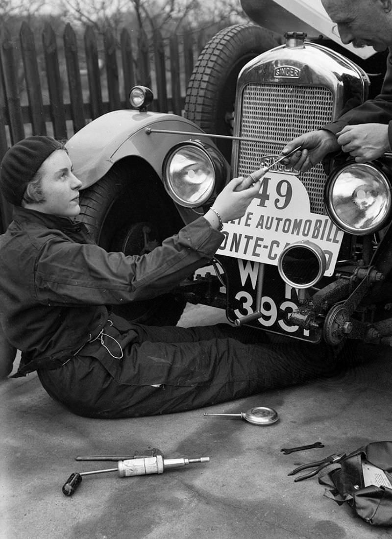 Kitty Brunell works on a Singer Junior 848 cc at the Monte Carlo Rally, 1928.