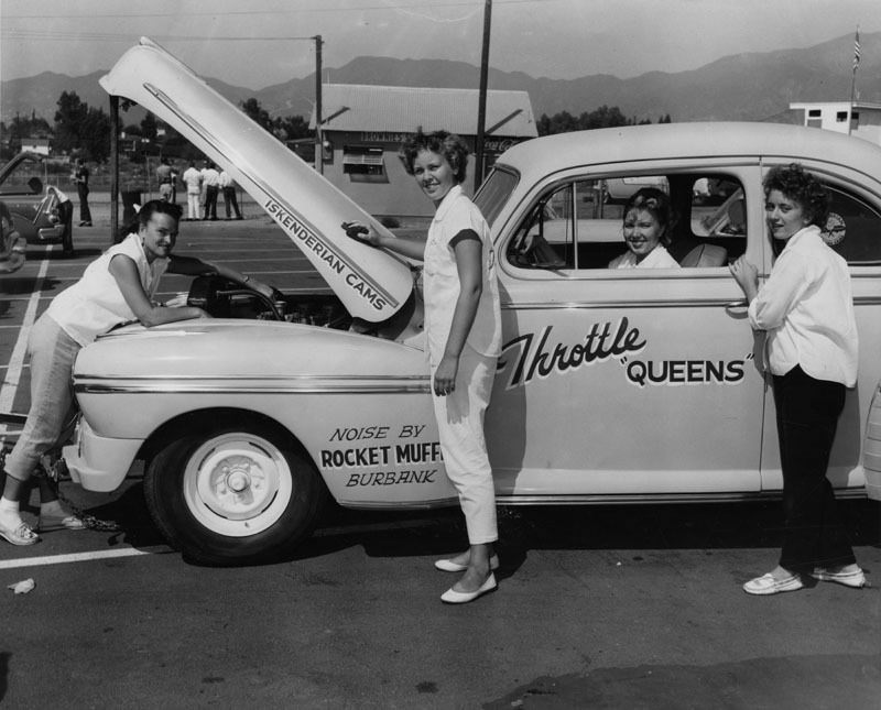 The Throttle Queens prepare for a drag race, 1956.