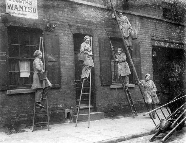 Women window cleaners working in Nottingham during World War I, 1917.