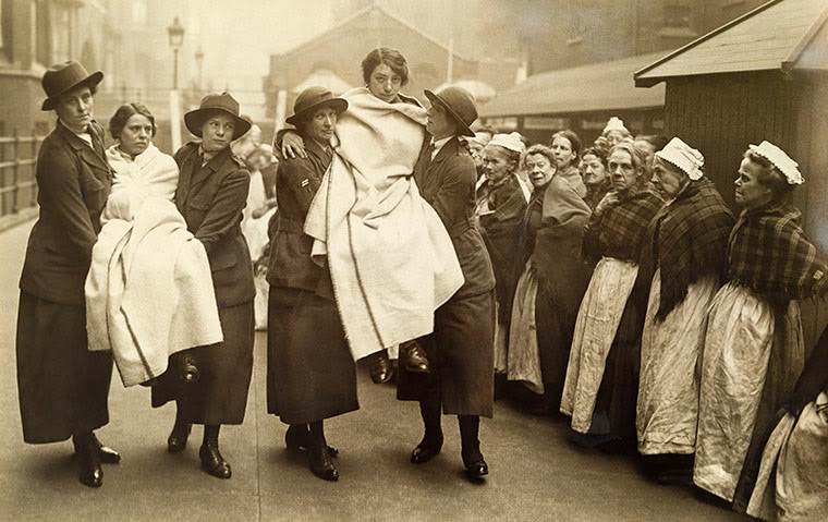 Workhouse women watching firefighting training, 1917.