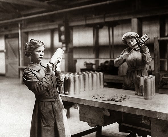 Women workers assembling artillery shells at a Vickers munitions factory during World War I.