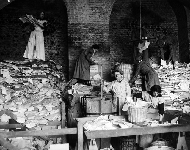 Women sorting paper for the London & South West Railway, 1917.