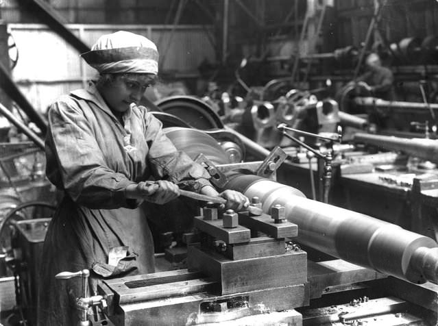 A woman at work in an armaments factory, 1914.