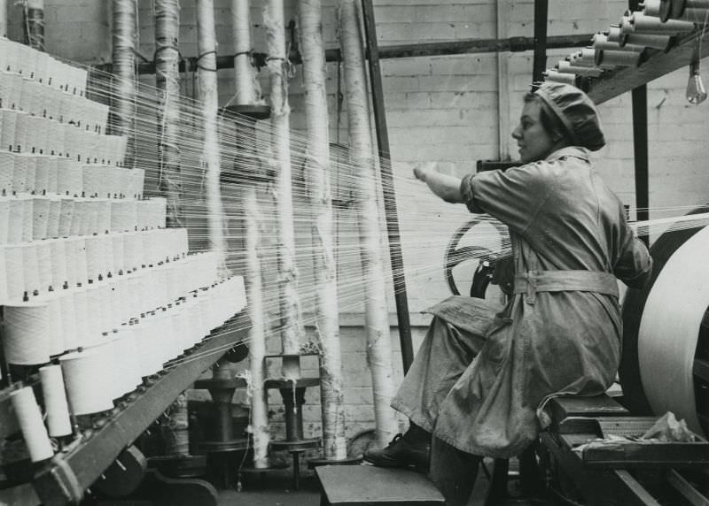 British woman winding cotton at a lace factory in Nottingham.