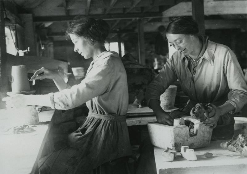 British women moulding and finishing stoneware taps at terra cotta works in Leicestershire.