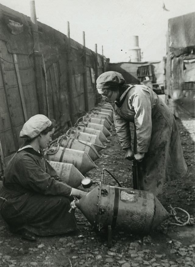 Women testing a mine with air pressure.