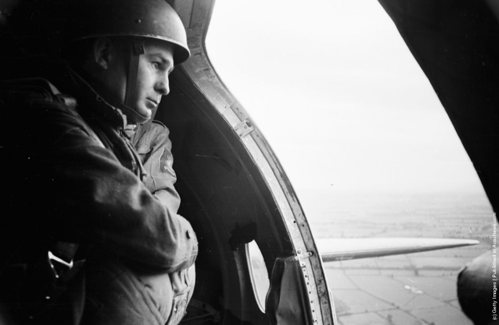 Daily Express newspaper photographer Terry Fincher on a parachuting exercise, 1965.