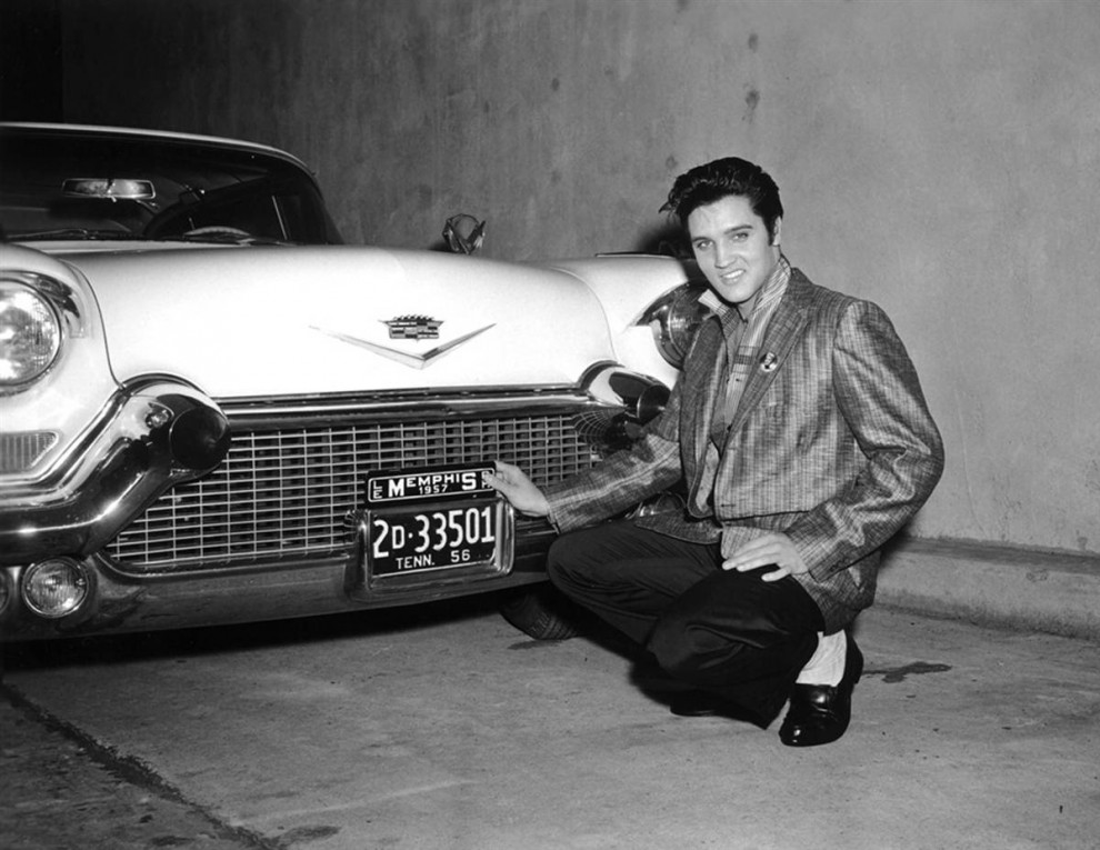 Elvis with one of his Cadillacs, 1957.