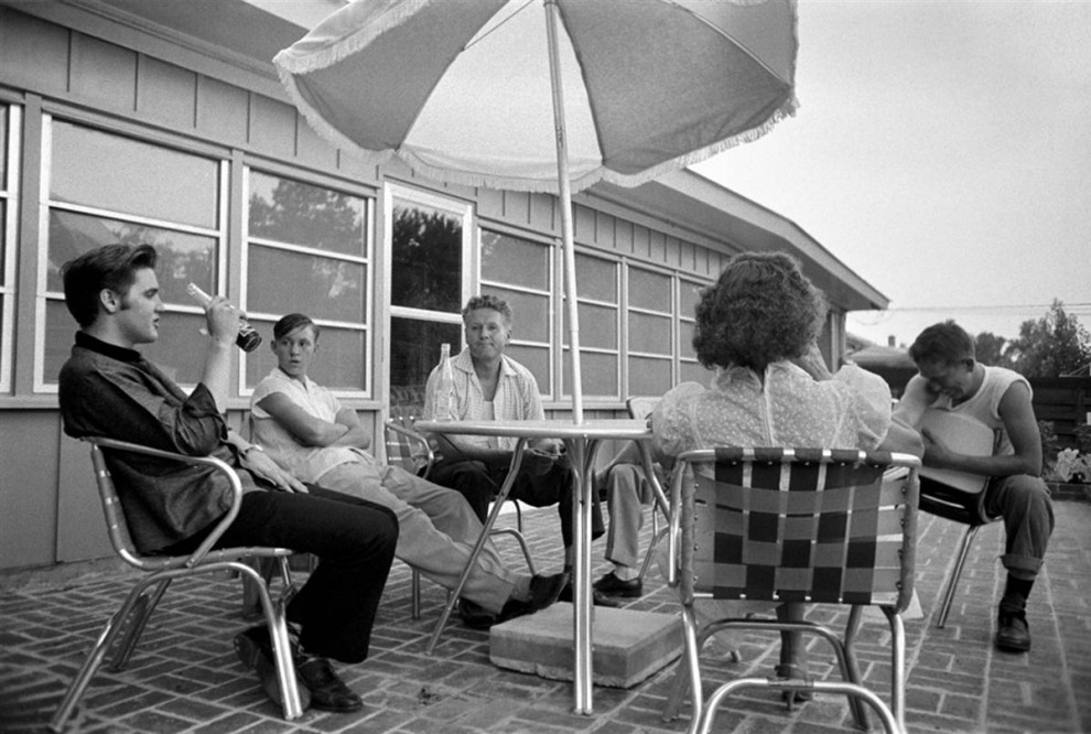 Elvis relaxing with family at his home, 1956.