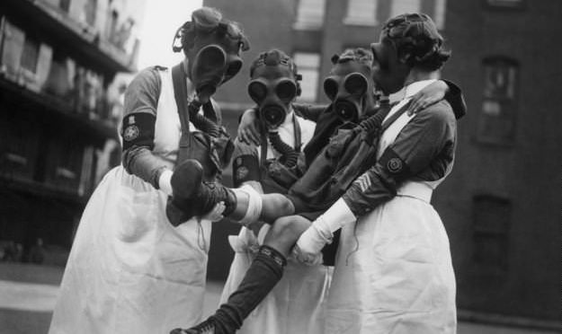 People wearing Gas mask 1920s 1930s
