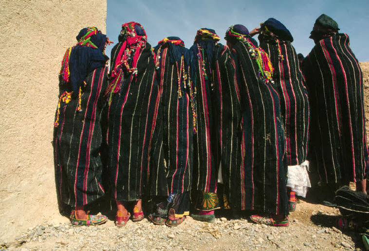 Young brides-to-be wearing capes of berber design and covered in silver ornaments, 1984.