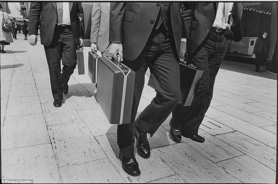 Rush hour at 57th Street as suited men head to work, 1980.