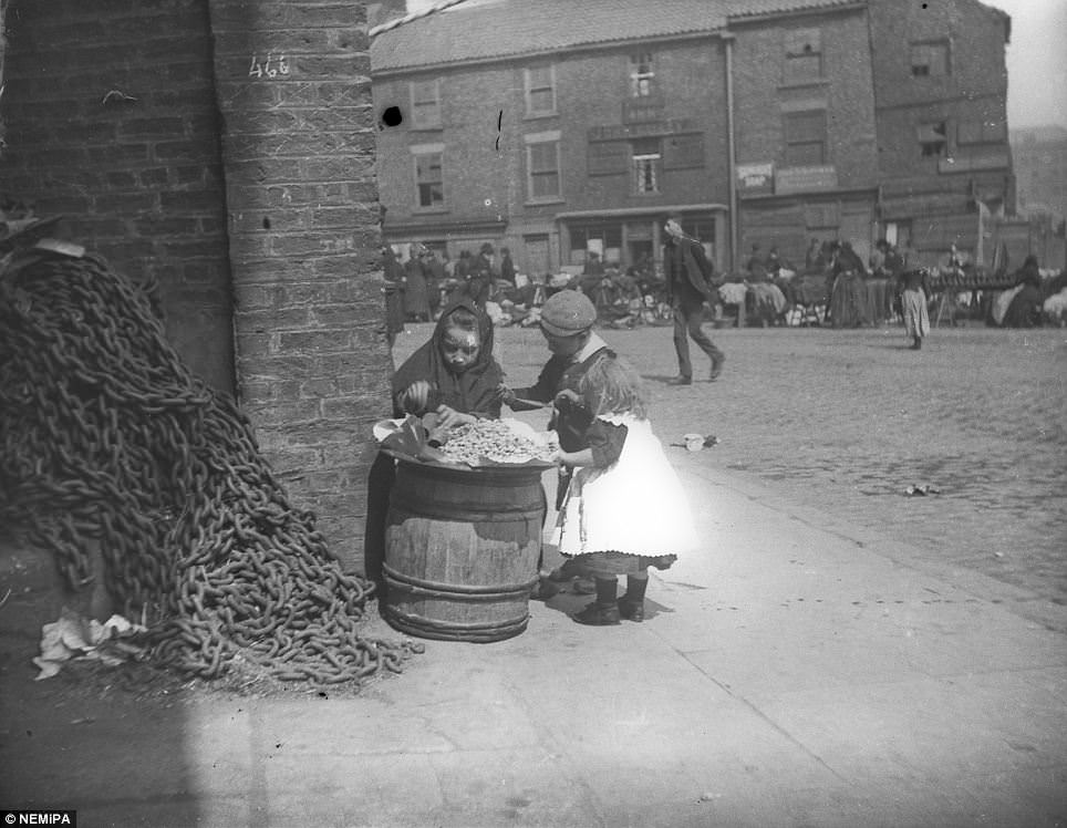 A young peanut seller captured at work.
