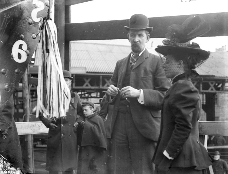 Onlookers wait for the launch of a ship in Tyneside.